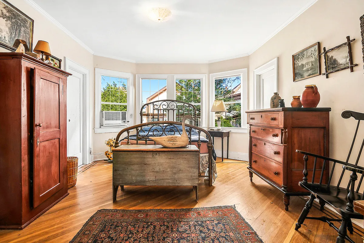 bedroom with bay window, wood floor