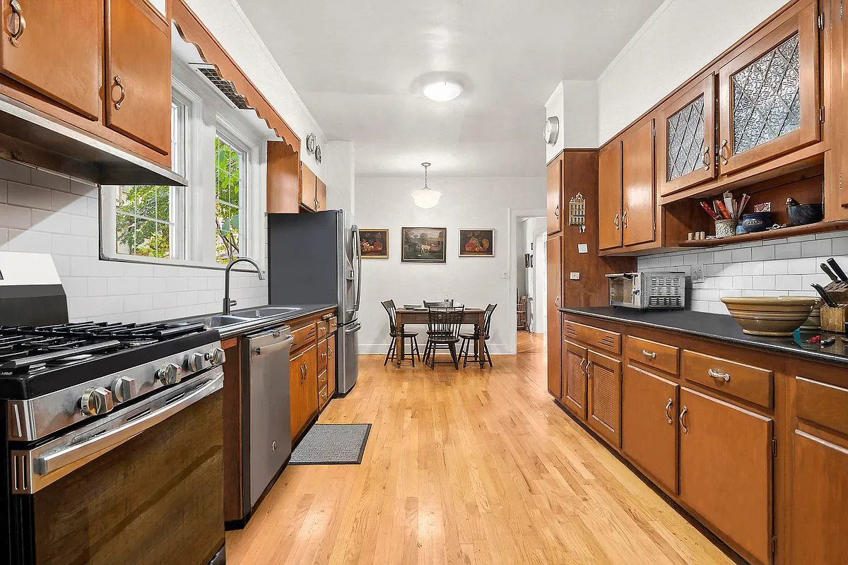 kitchen with wood floor, wood cabinets