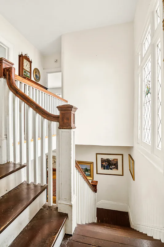 stair landing with stained glass detail