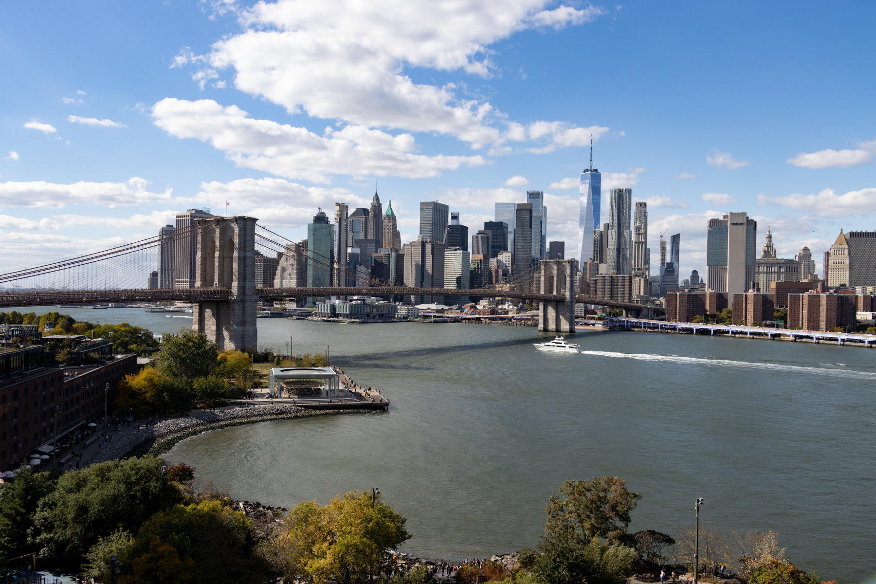 manhattan skyline viewed from brooklyn with a view of the brooklyn bridge