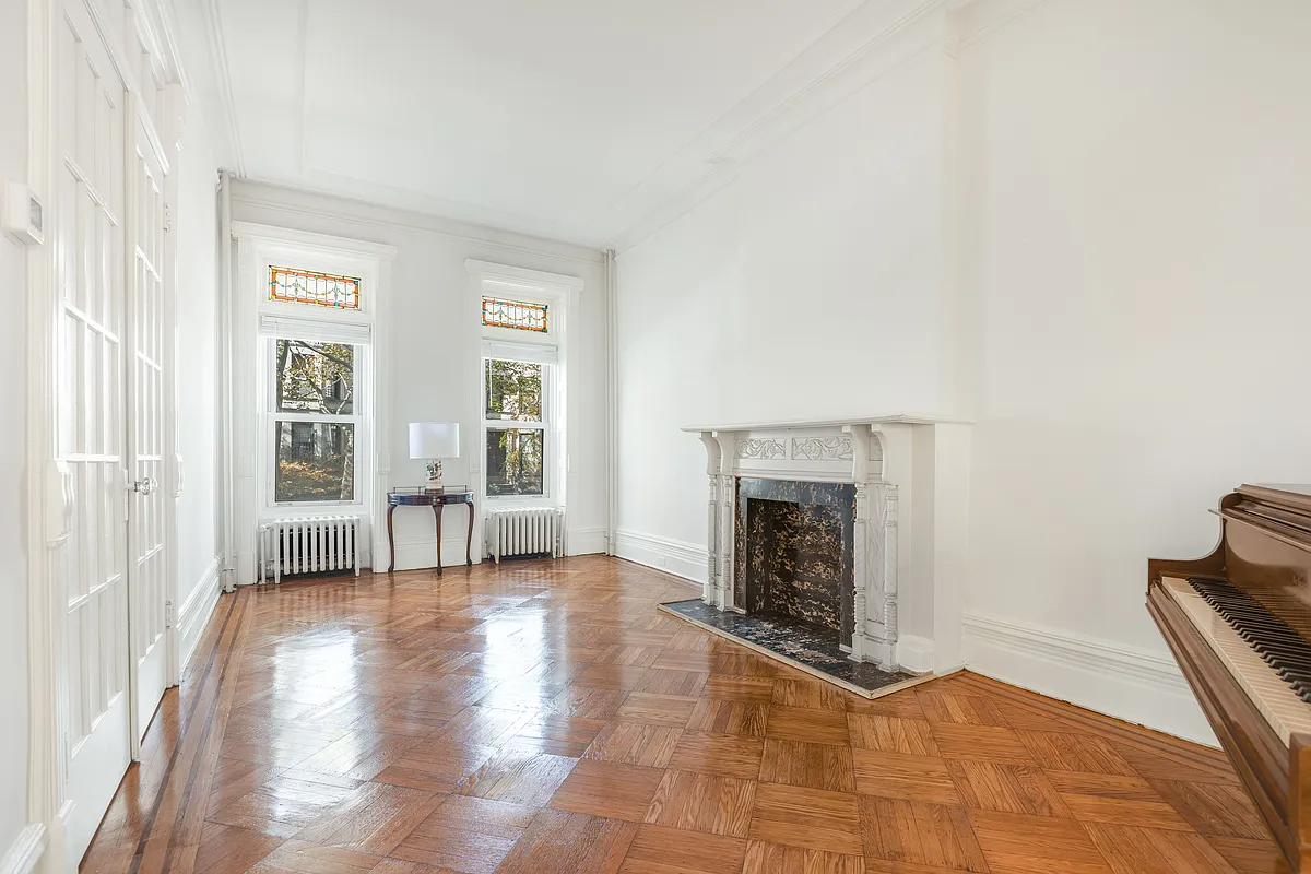 parlor with stained glass and mantel