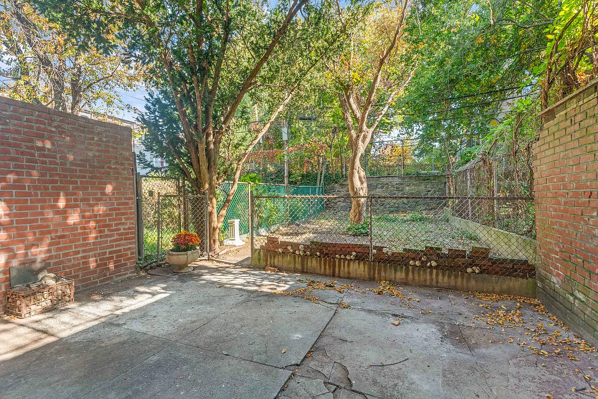 rear yard with concrete pad, chain link fence