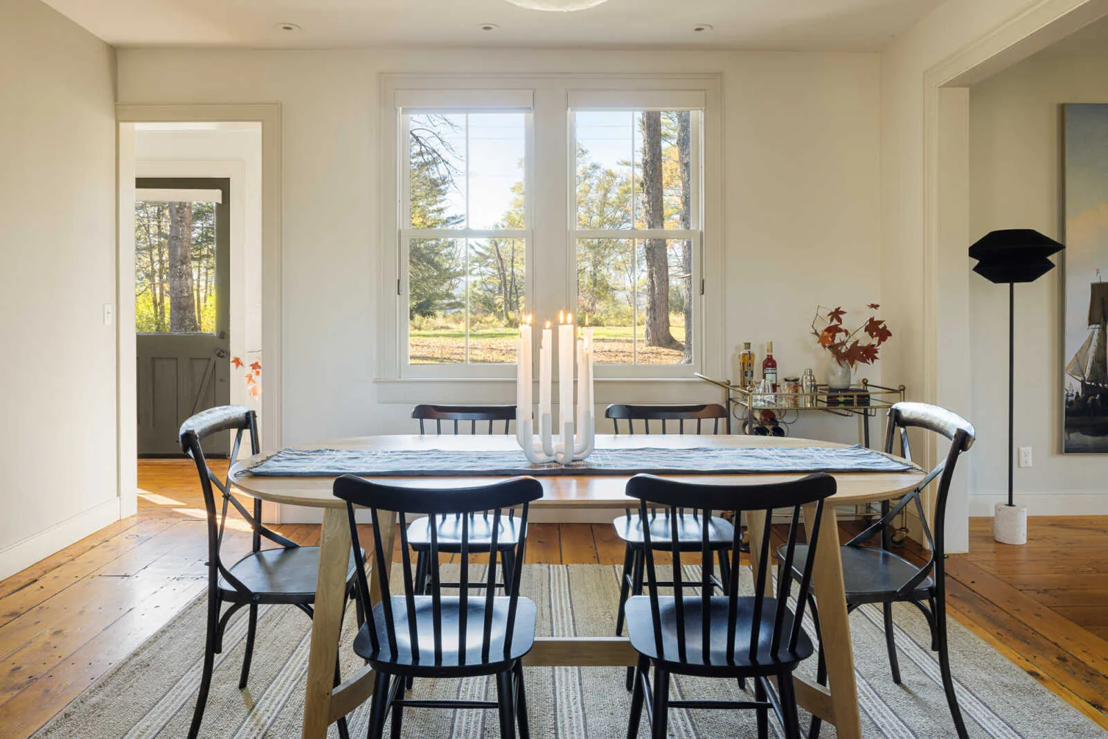 dining area with view to outdoors and access to a hall with exterior door