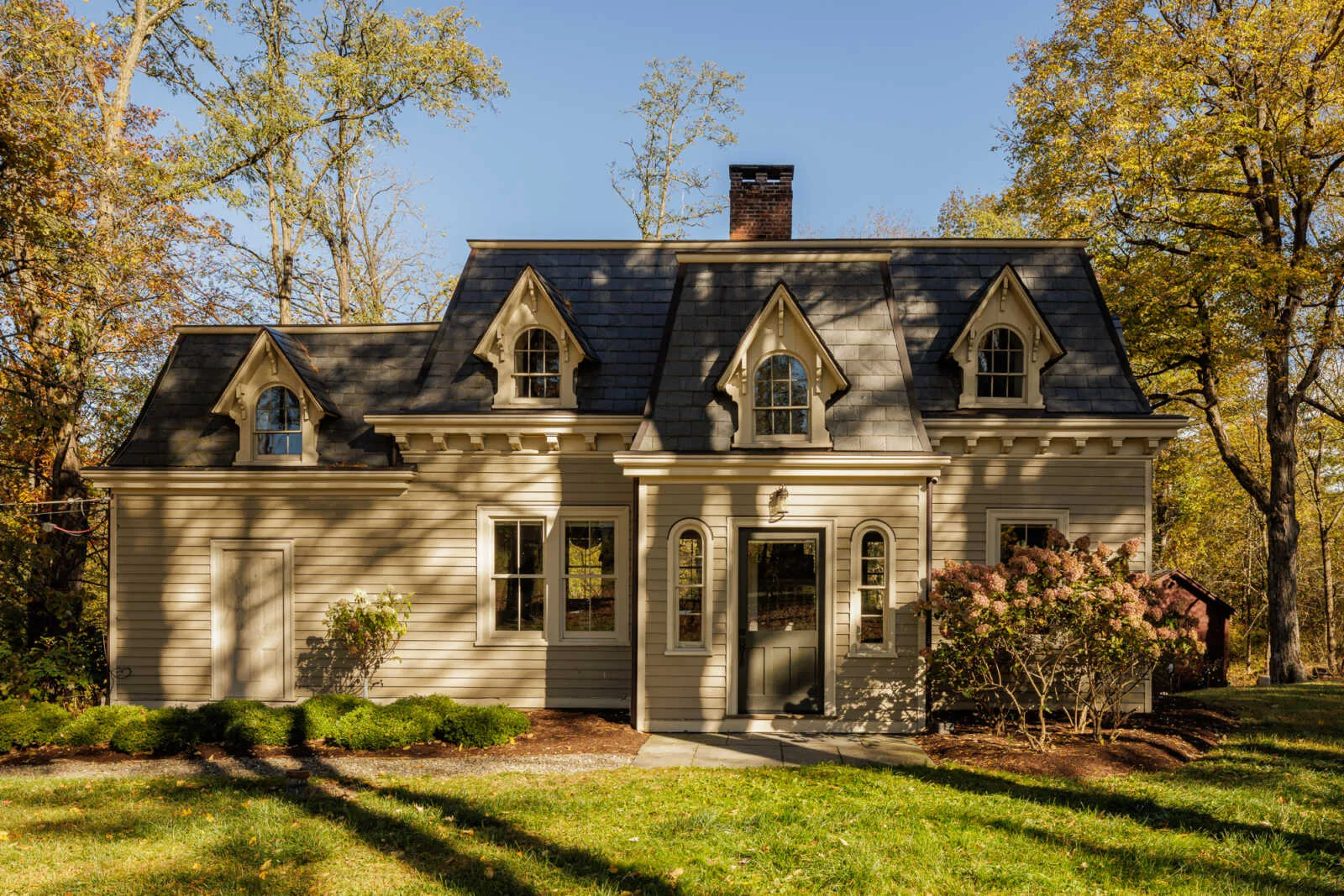 rhinebeck - clapboard former dairy with mansard roof and dormers