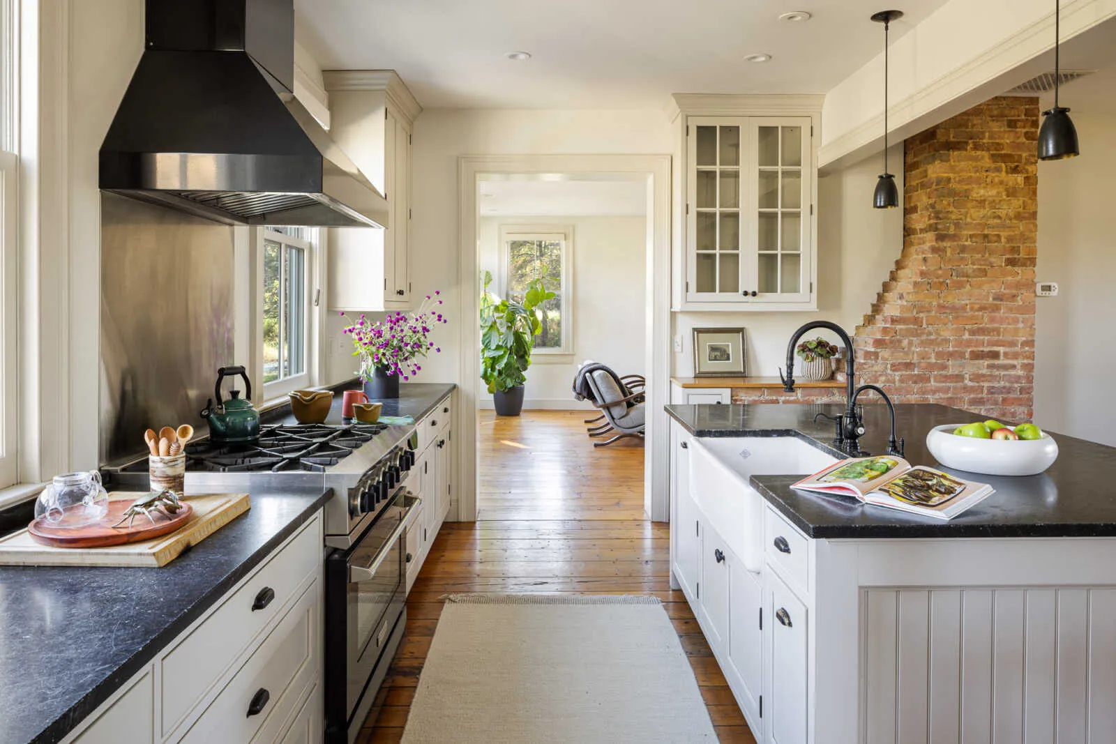 kitchen with white Shaker style cabinets and a center island with apron front sink