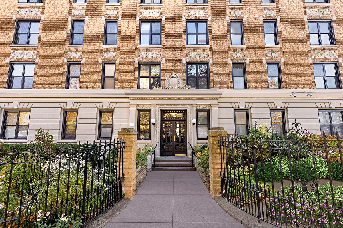 beige brick exterior with low stoop