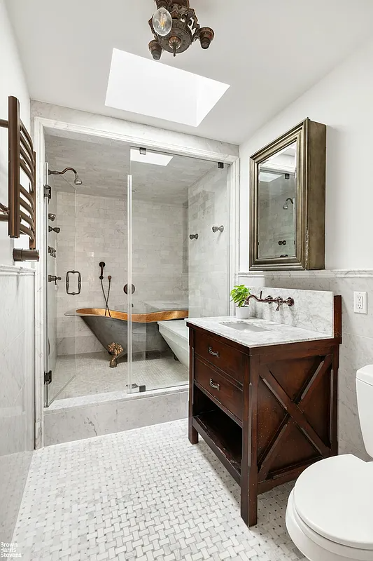 bathroom with walk in shower with soaking tub