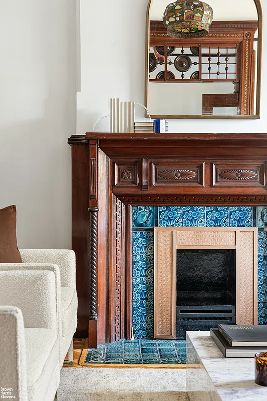 detail of mantel in parlor with blue tile surround