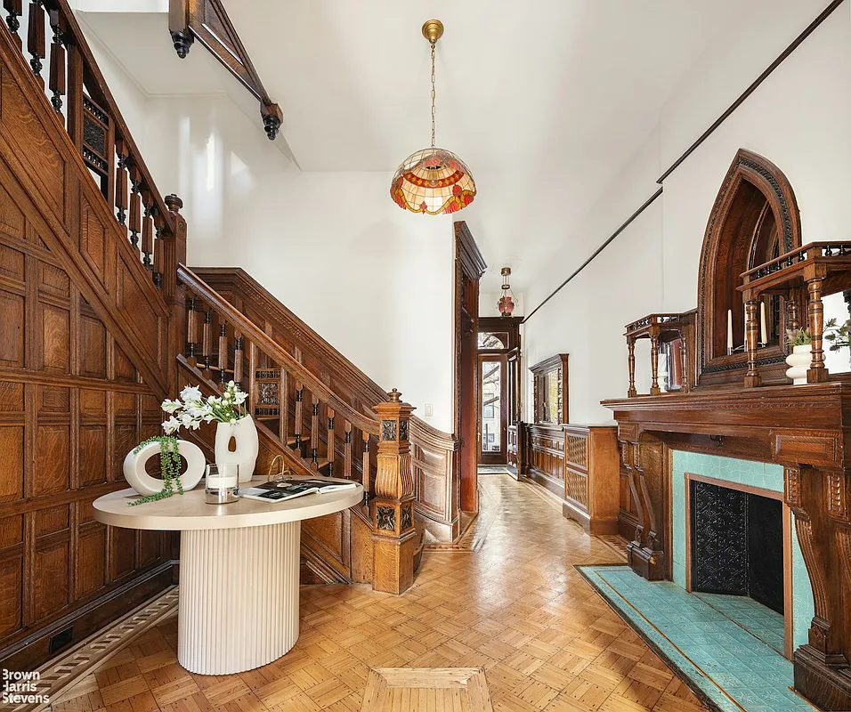 bed stuy - middle parlor with stair, ornate mantel, wood floor