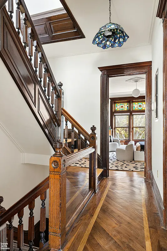 hall showing unpainted woodwork on original stair