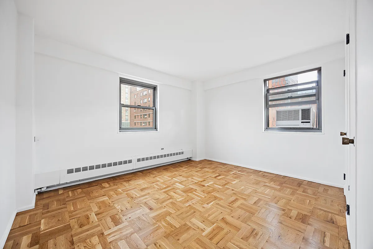 bedroom with two exposures, wood floor