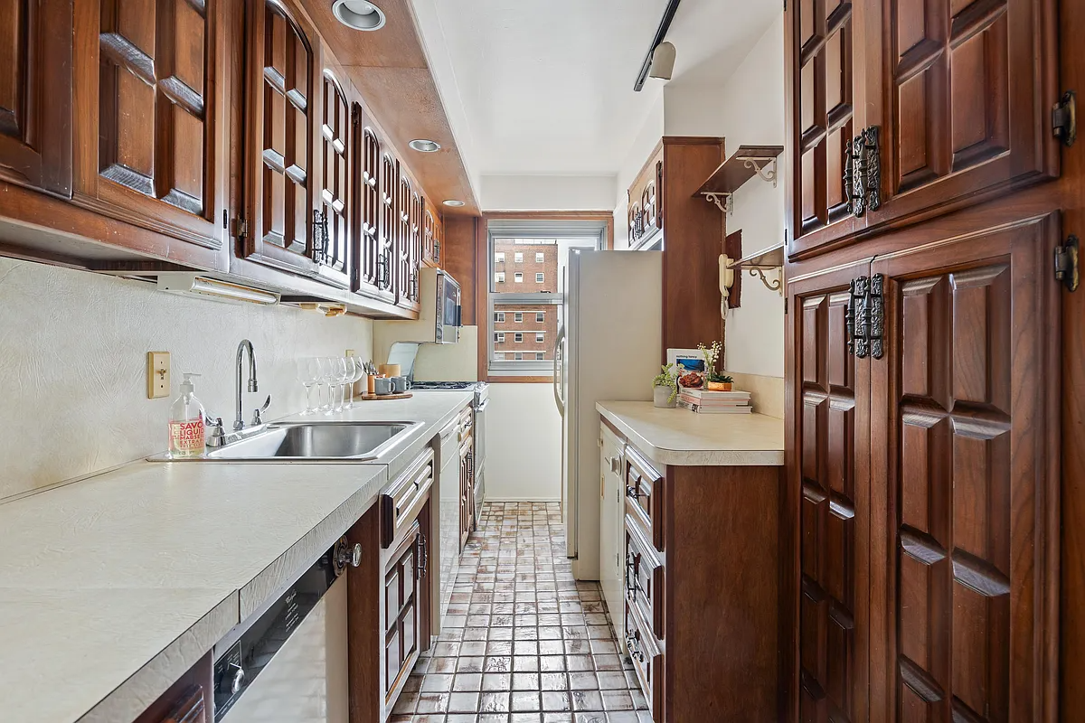 kitchen with wood cabinets with ornate iron hardware