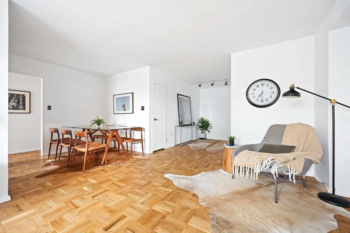 living room with wood floor, white walls