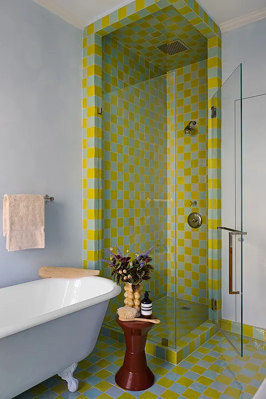 bathroom with blue and green checkerboard floor