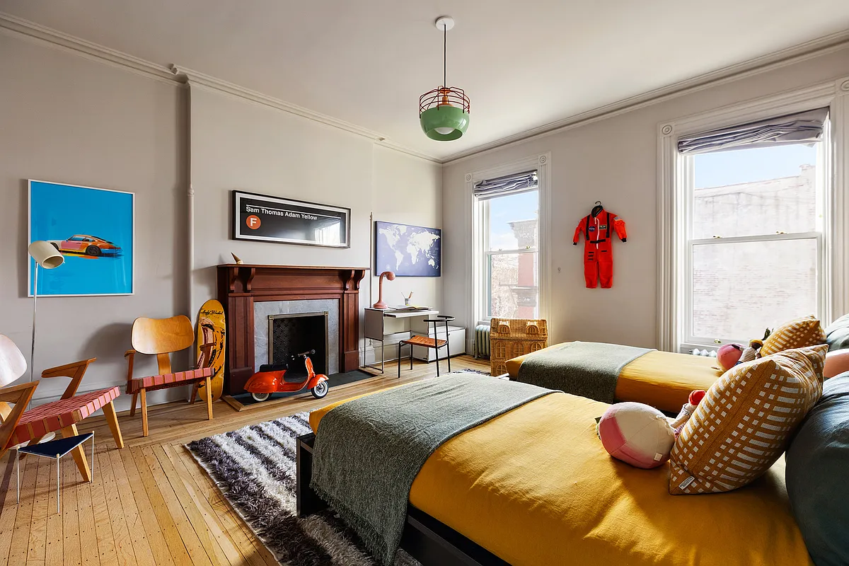 bedroom with wood floor, wood mantel