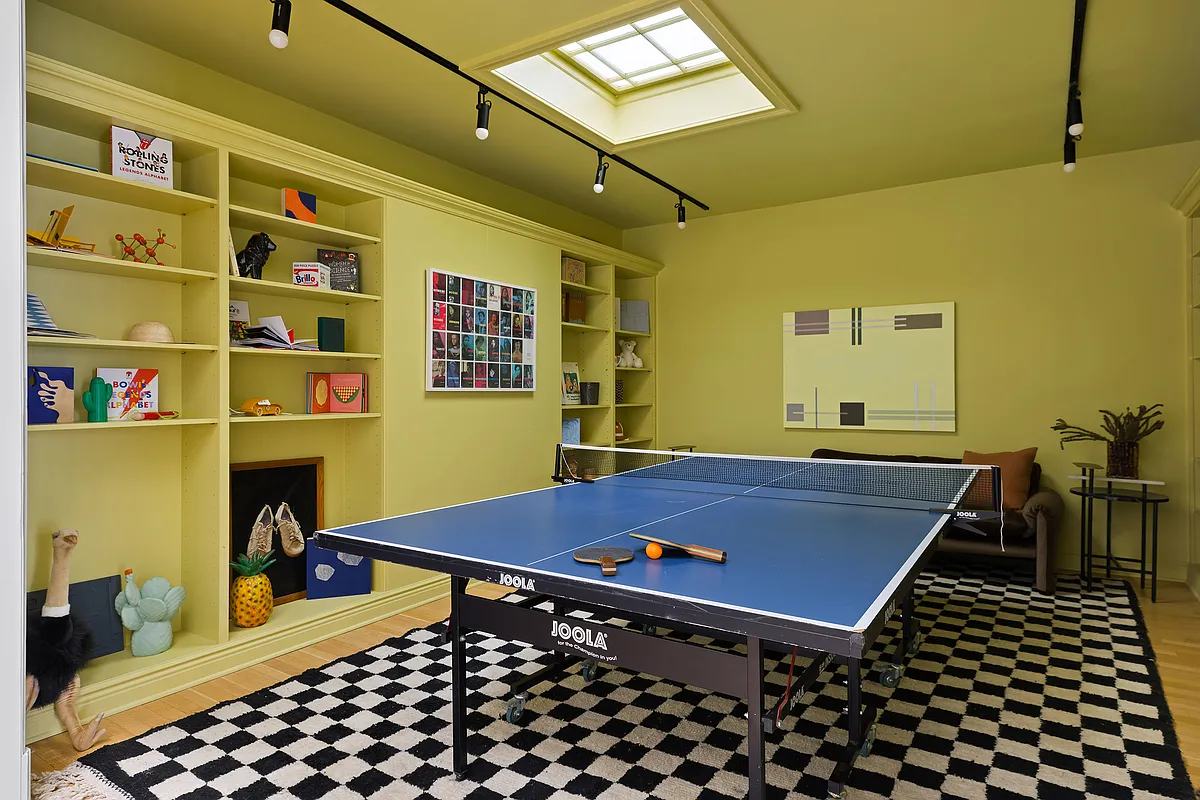 play room with skylight and yellow walls