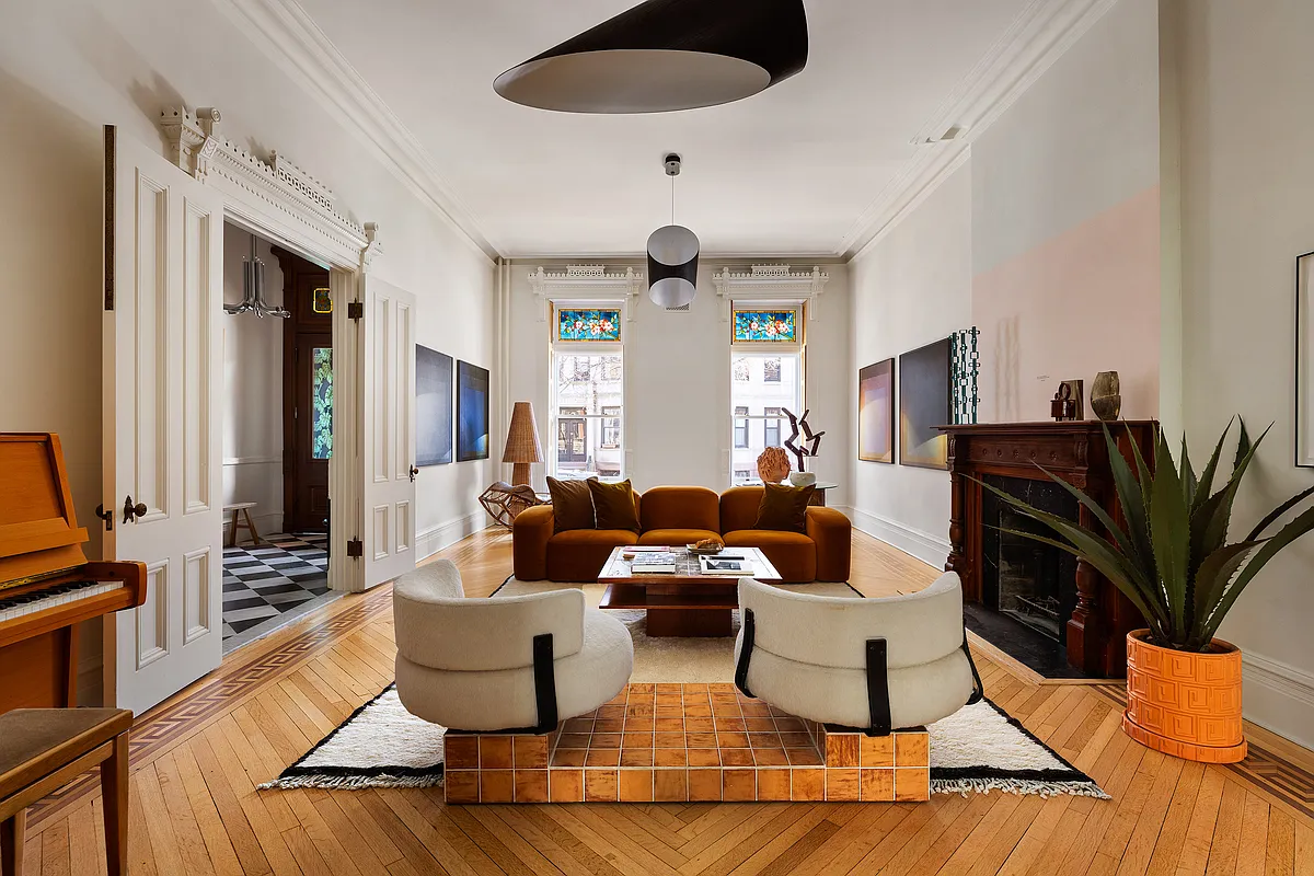 parlor with moldings, stained glass, wood floor