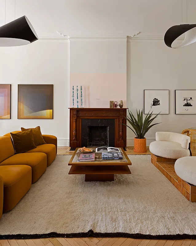 parlor with wood mantel, wood floor