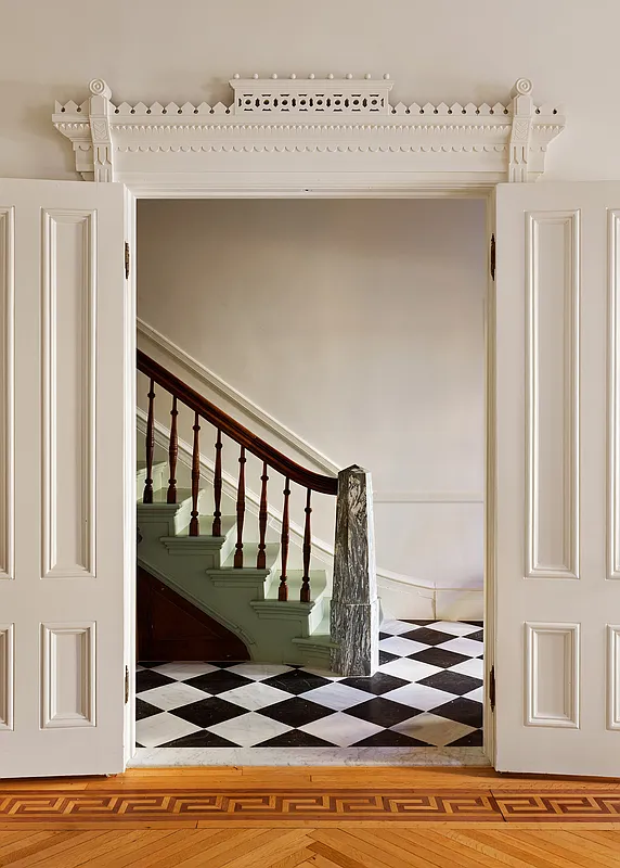 entry with stair with modern newel