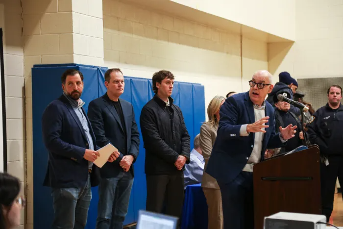 Developers address the crowd at the Jan. 9 hearing