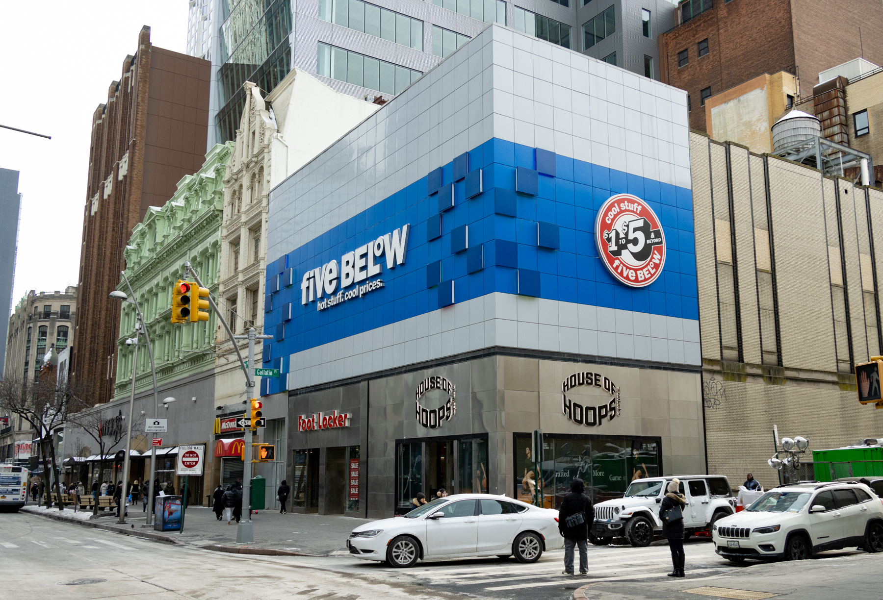 bright blue five below sign on corner commercial building