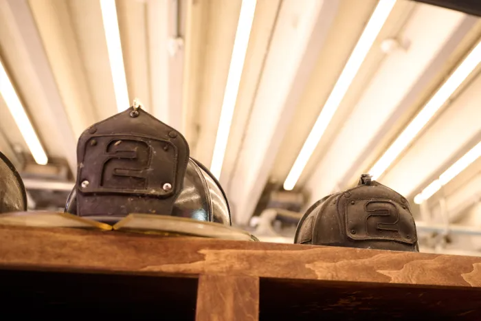 firefighter helmets on a shelf