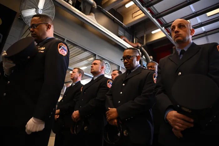 A solemn moment during the anniversary ceremony as firefighters reflect on the 12 Rescue 2 members lost in the line of duty. Their sacrifices are forever etched into the company’s history.
