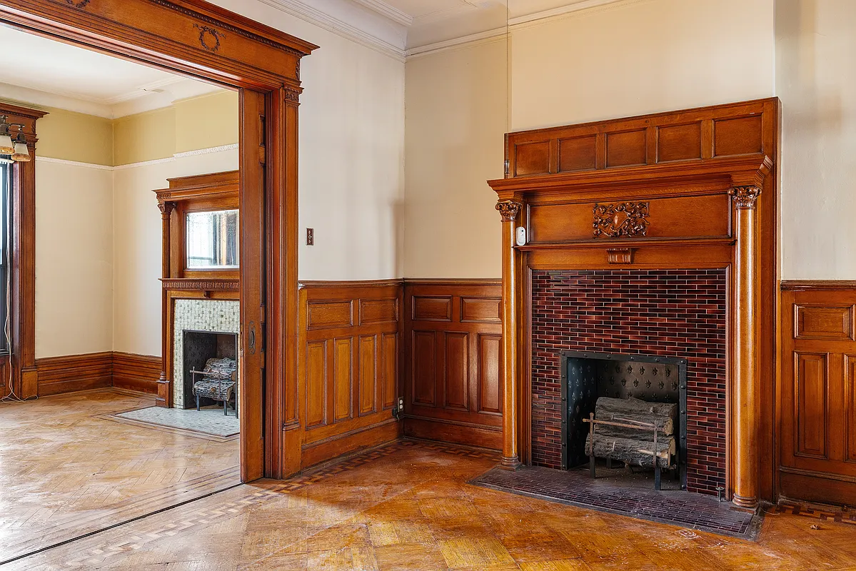 middle parlor with wainscoting, columned mantel