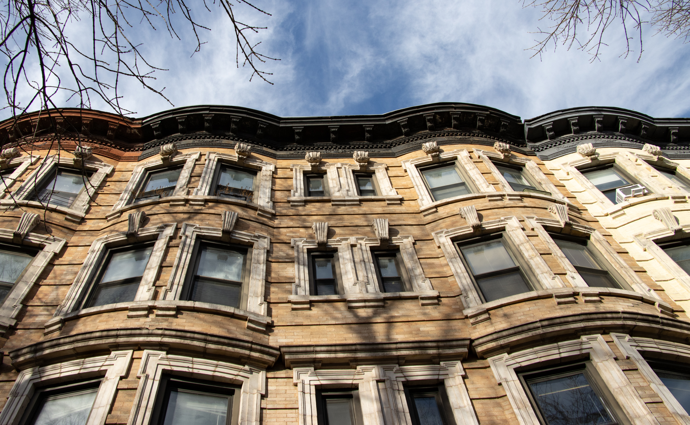 brooklyn news - looking up at cornices on brick buildings in prospect heights